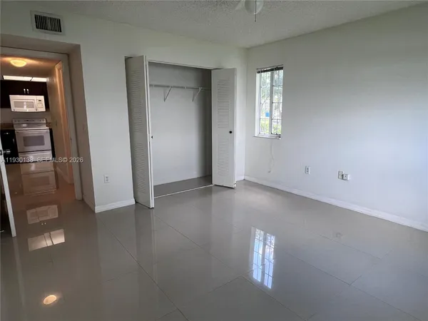 a view of an empty room and window