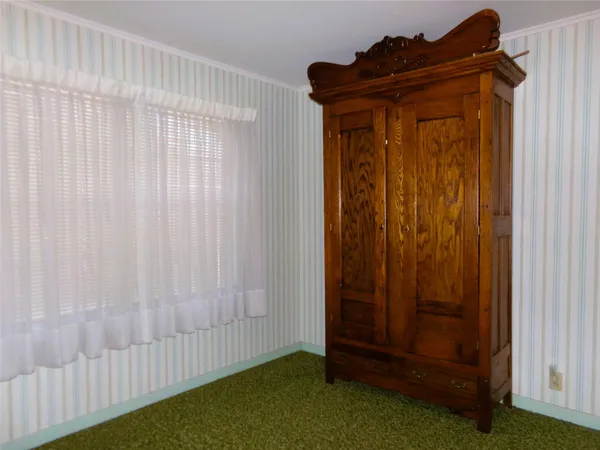 a view of wooden door and entryway
