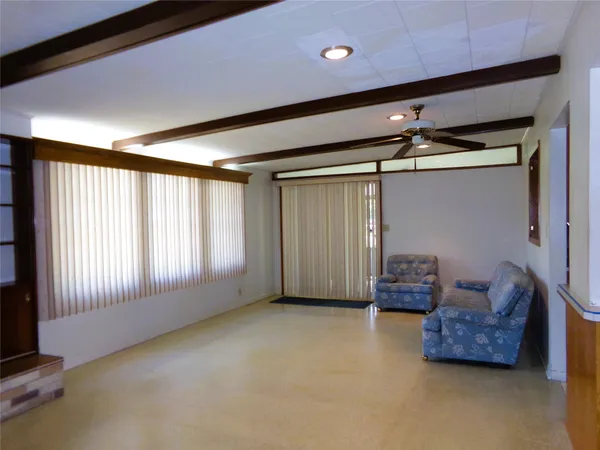 a view of livingroom with furniture and windows
