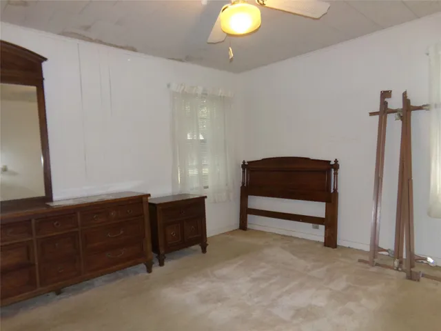 a view of room with furniture and windows