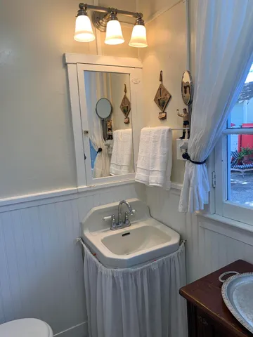 a bathroom with a sink and mirror