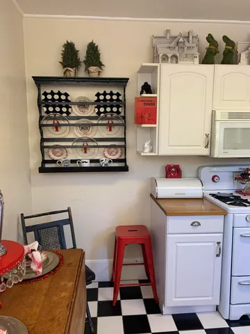 a room with furniture a rug and a window