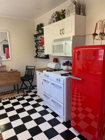 a kitchen with stainless steel appliances a sink and a cabinets