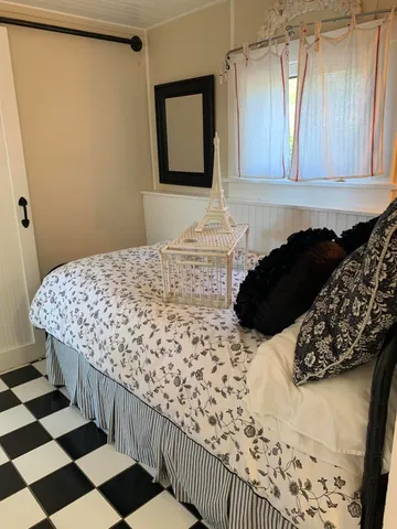 a bedroom with a bed and a cabinets