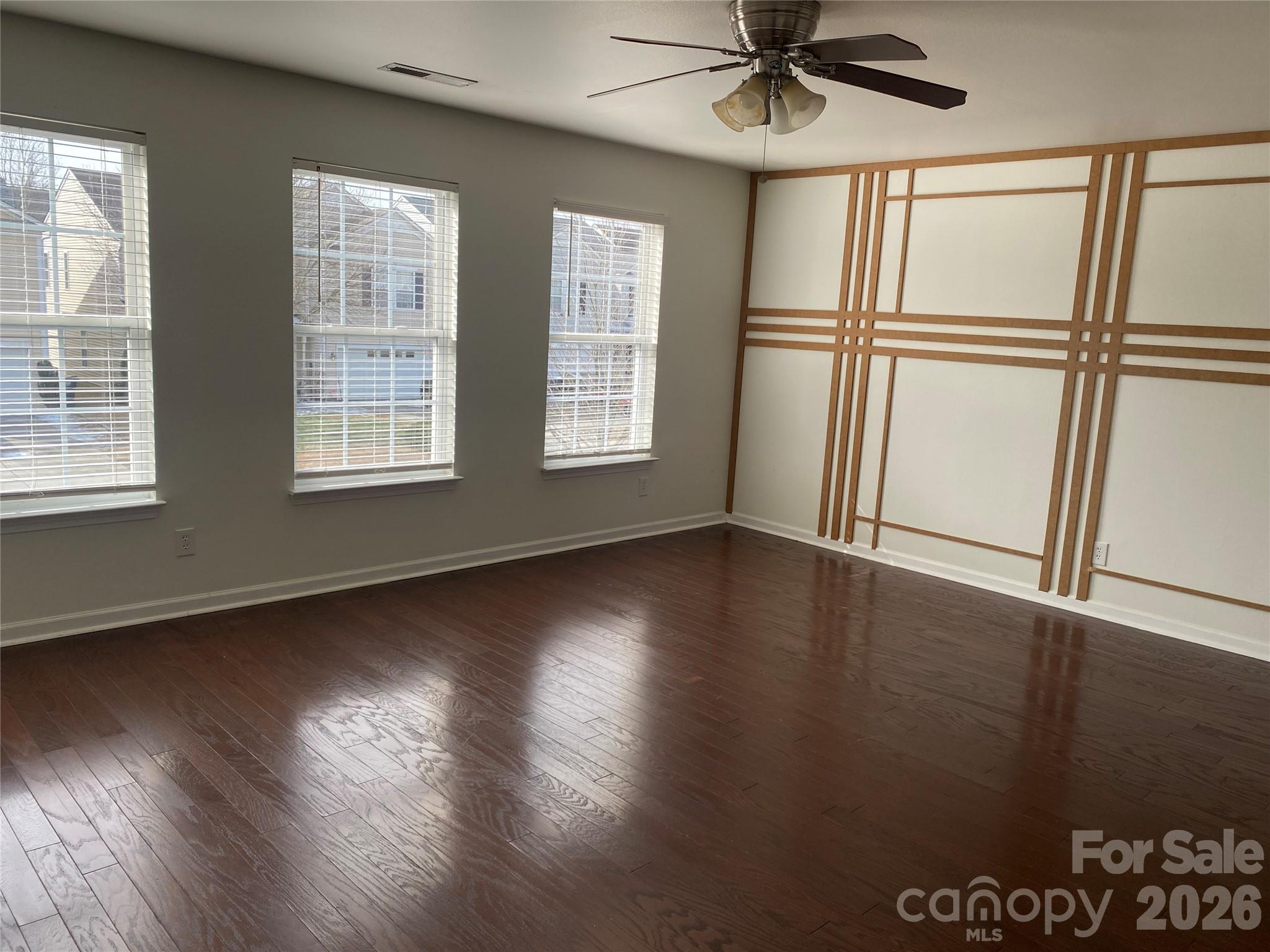2054 Durand Road Fort Mill, SC 29715 - Photo 15 of 30 a view of an empty room with wooden floor and a window