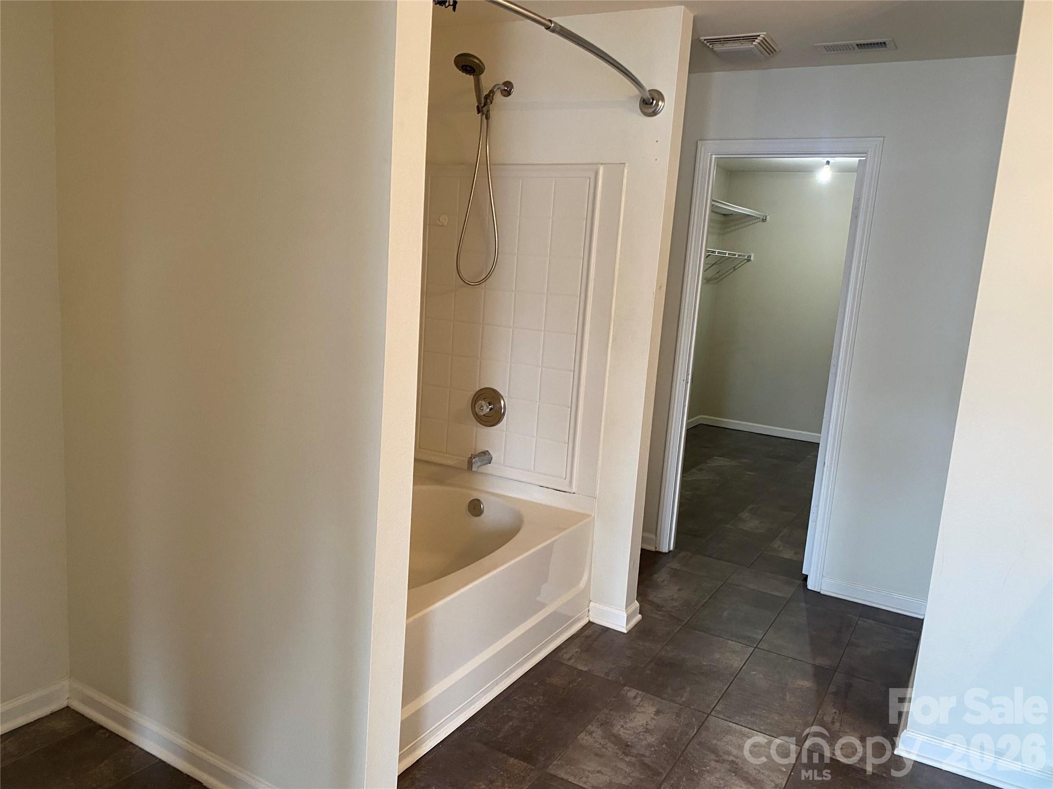 2054 Durand Road Fort Mill, SC 29715 - Photo 18 of 29 a bathroom with a bathtub and a shower