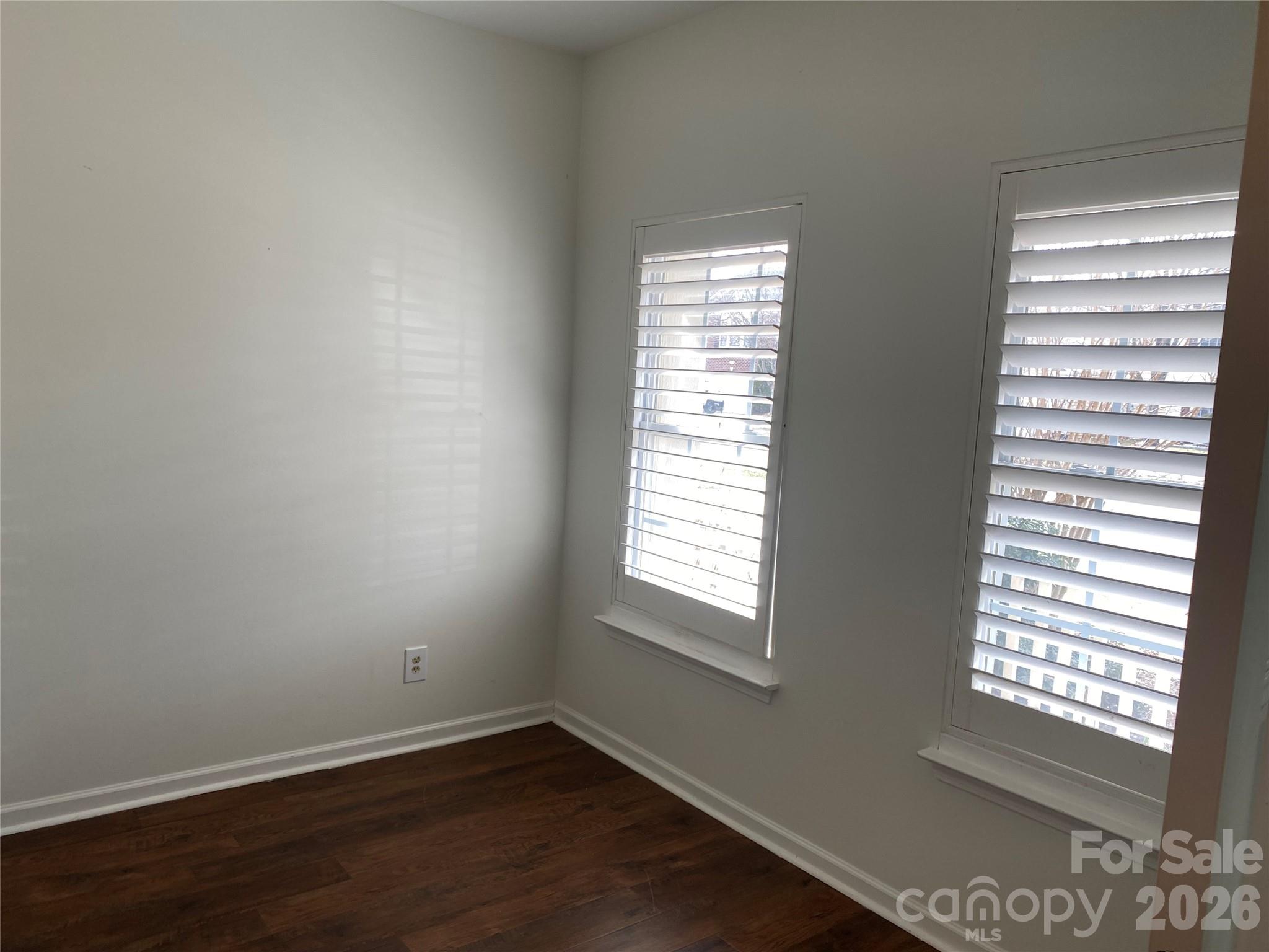 2054 Durand Road Fort Mill, SC 29715 - Photo 21 of 30 a view of an empty room with wooden floor and a window