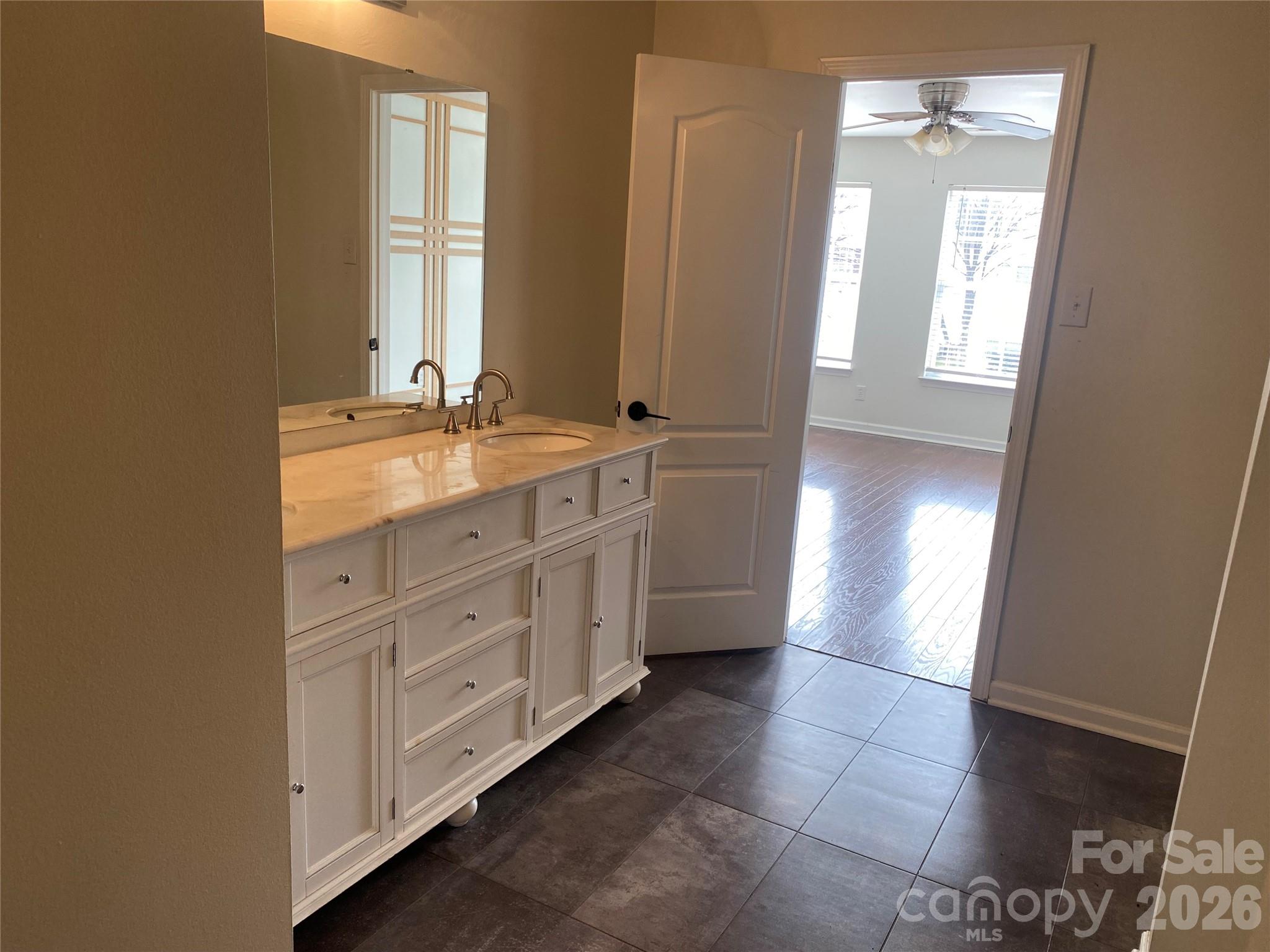 2054 Durand Road Fort Mill, SC 29715 - Photo 25 of 29 a spacious bathroom with a double vanity sink and a mirror