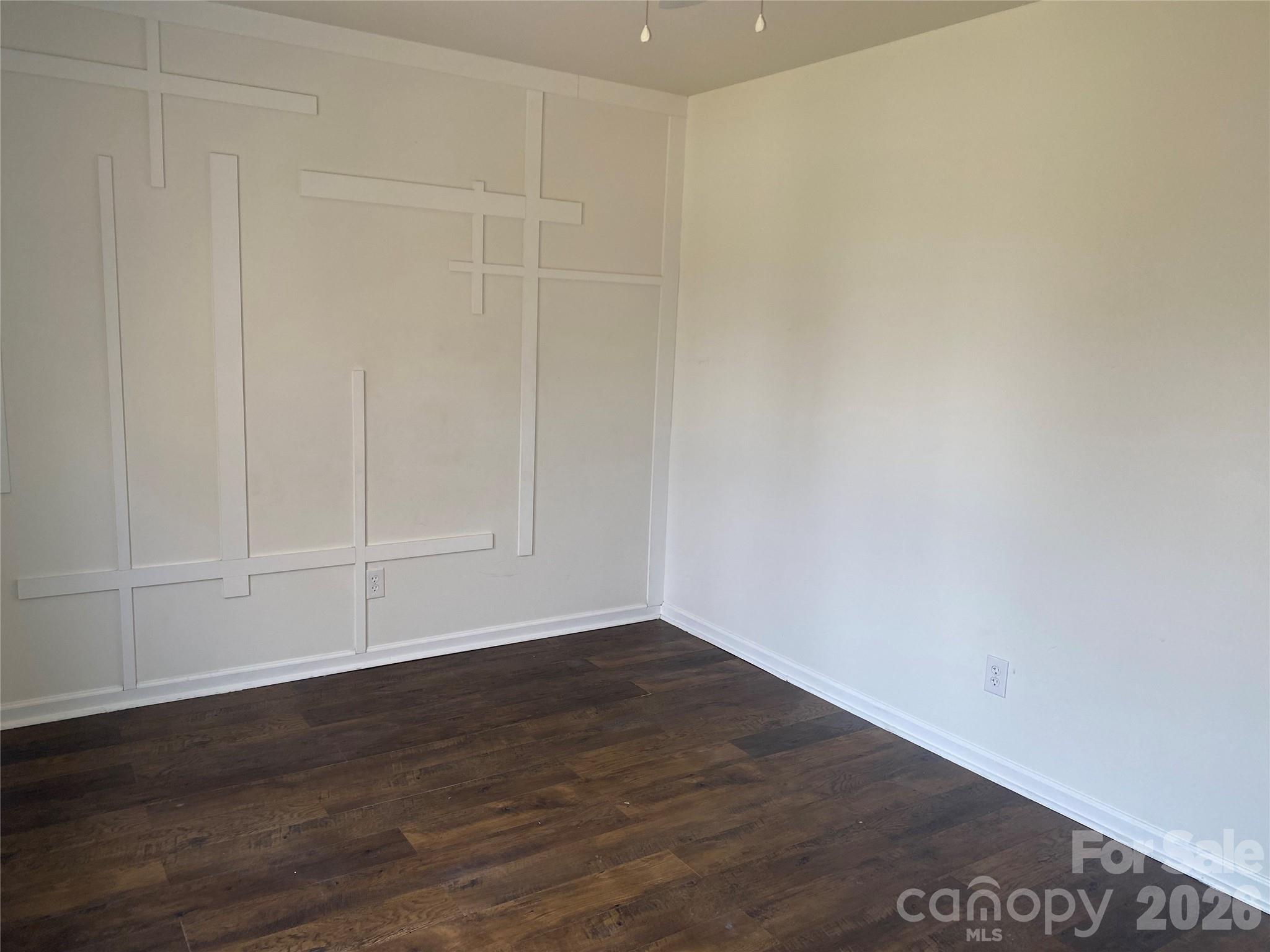 2054 Durand Road Fort Mill, SC 29715 - Photo 27 of 29 a view of an empty room with wooden floor