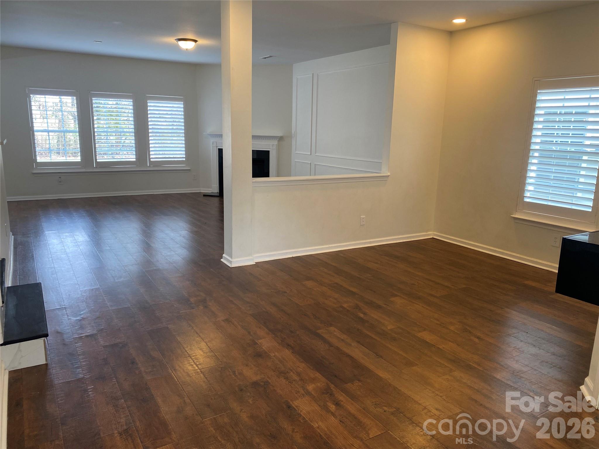 2054 Durand Road Fort Mill, SC 29715 - Photo 3 of 29 an empty room with wooden floor and windows