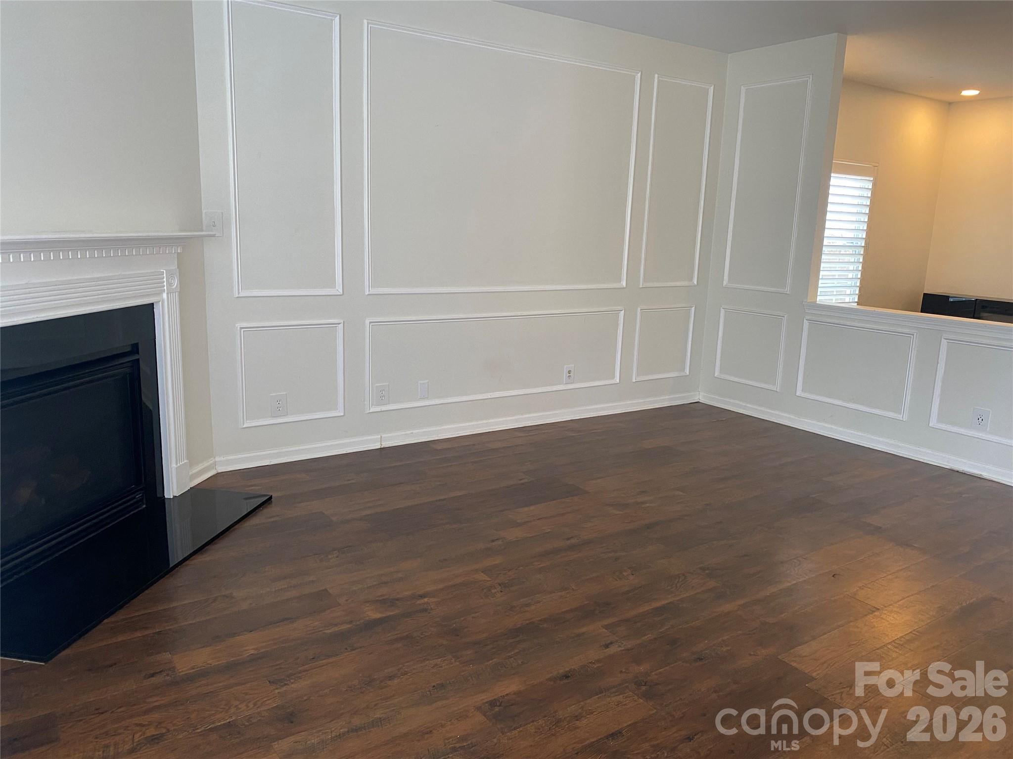 2054 Durand Road Fort Mill, SC 29715 - Photo 5 of 29 a view of an empty room with wooden floor and a window