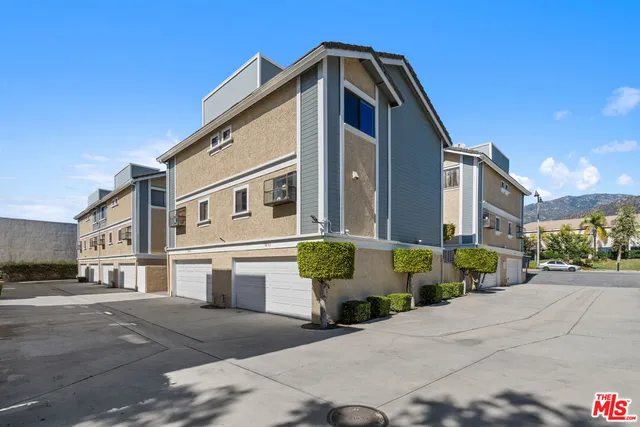 a front view of a house with outdoor space