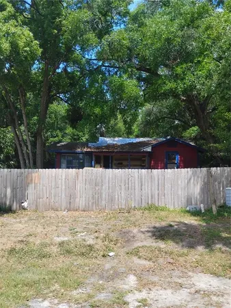 a view of outdoor space with wooden fence