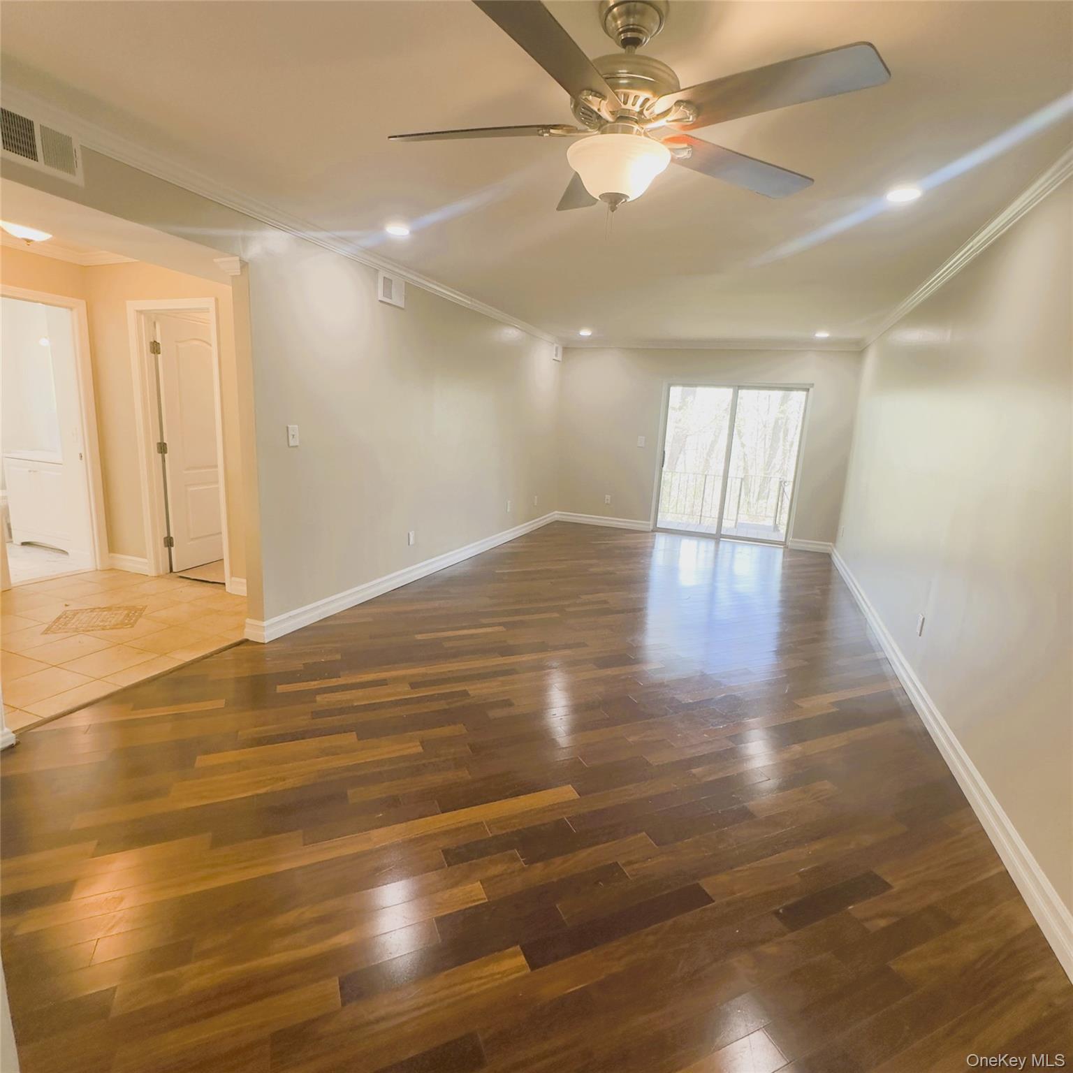 26 Cooper, Unit 603 Poughkeepsie, NY 12603 - Photo 4 of 16 Wooden flooring, ceiling fan, recess lighting, crown molding