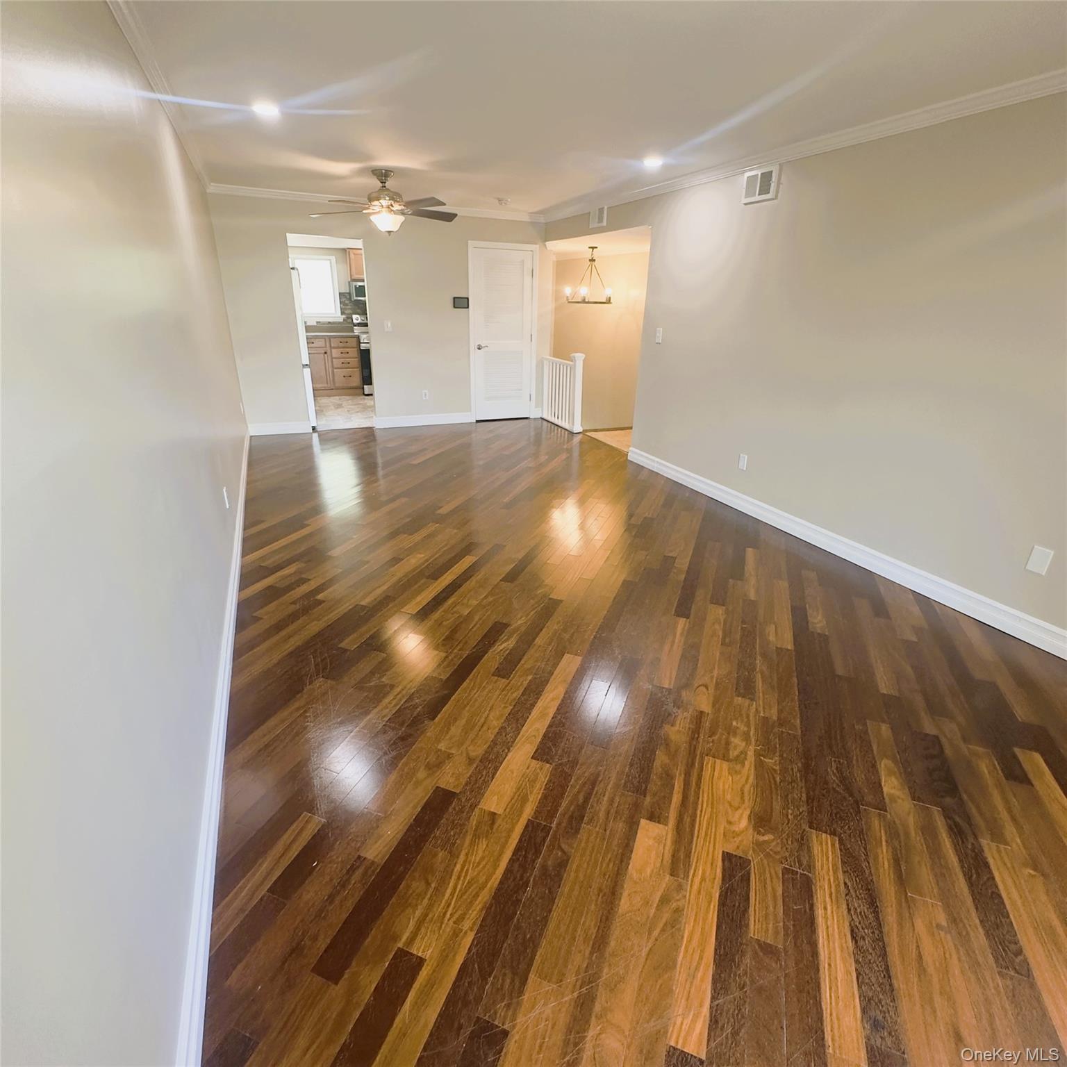 26 Cooper, Unit 603 Poughkeepsie, NY 12603 - Photo 5 of 16 Wooden flooring, recess lighting, crown molding.