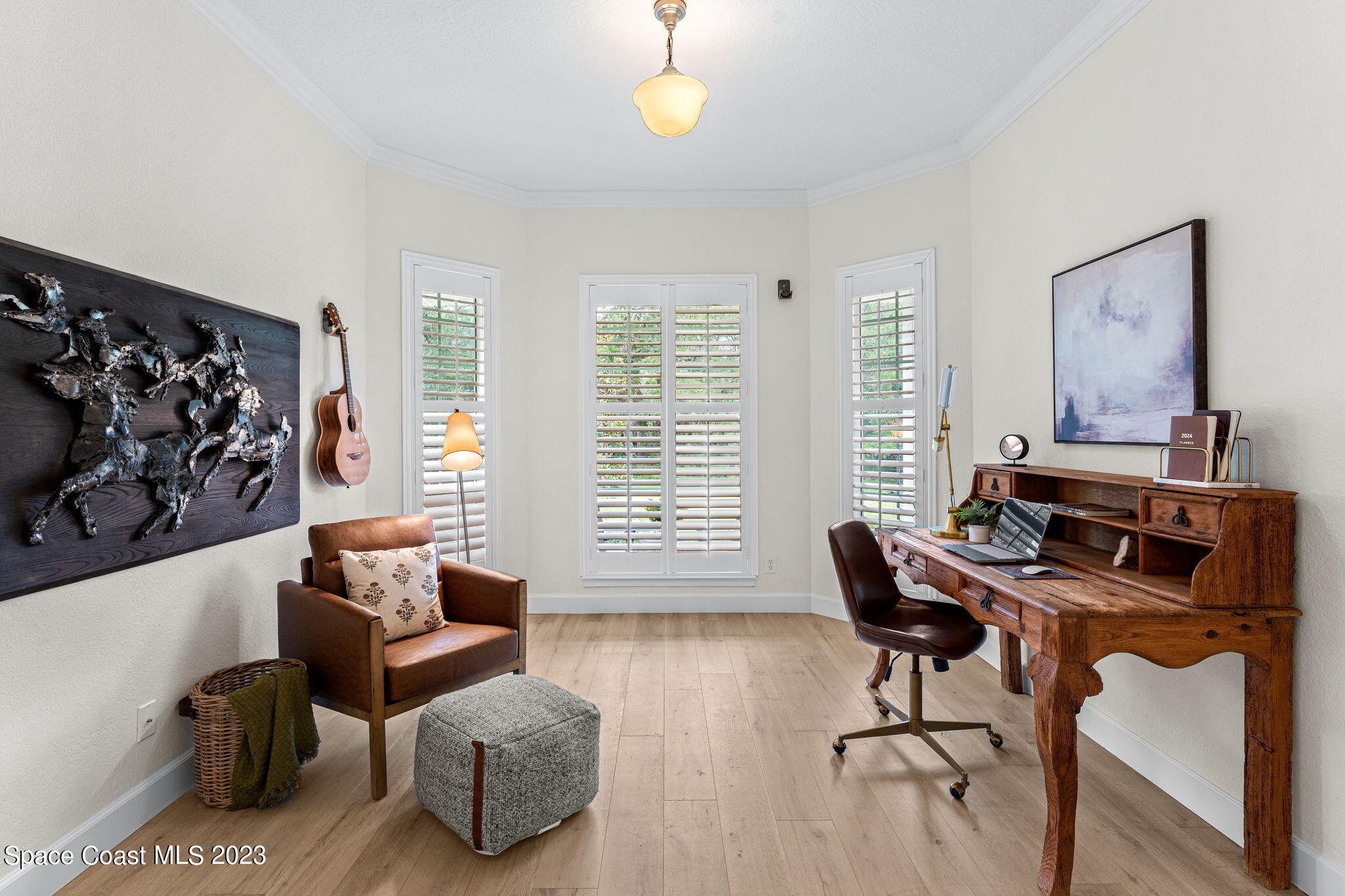 5595 Willoughby Drive Melbourne, FL 32934 - Photo 13 of 40 a living room with furniture and a wooden floor
