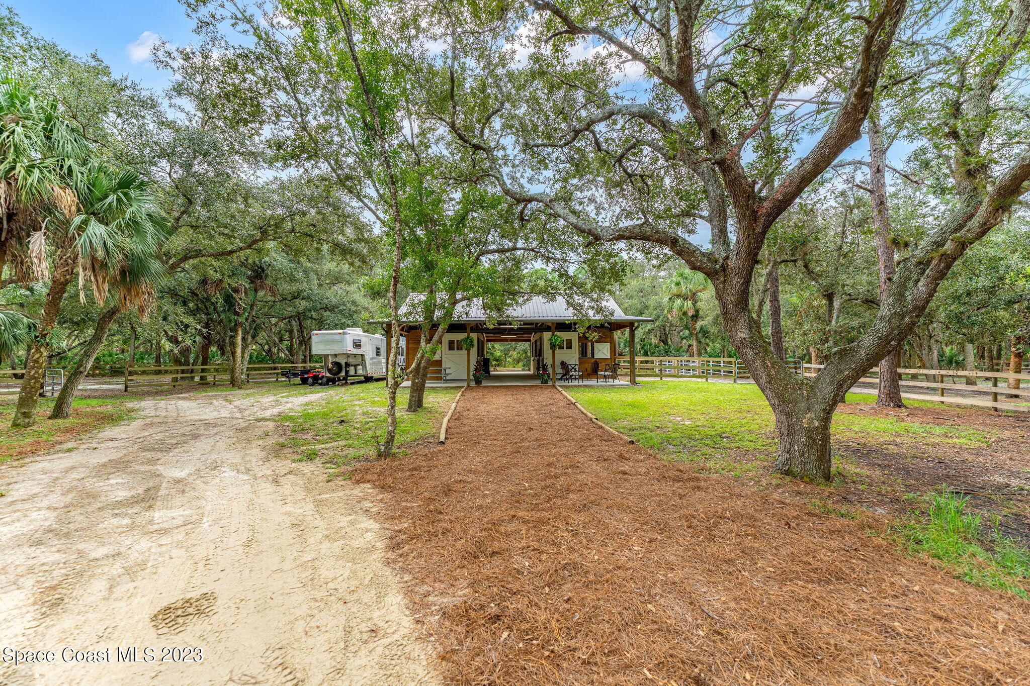 5595 Willoughby Drive Melbourne, FL 32934 - Photo 29 of 40 a view of a yard with tree s