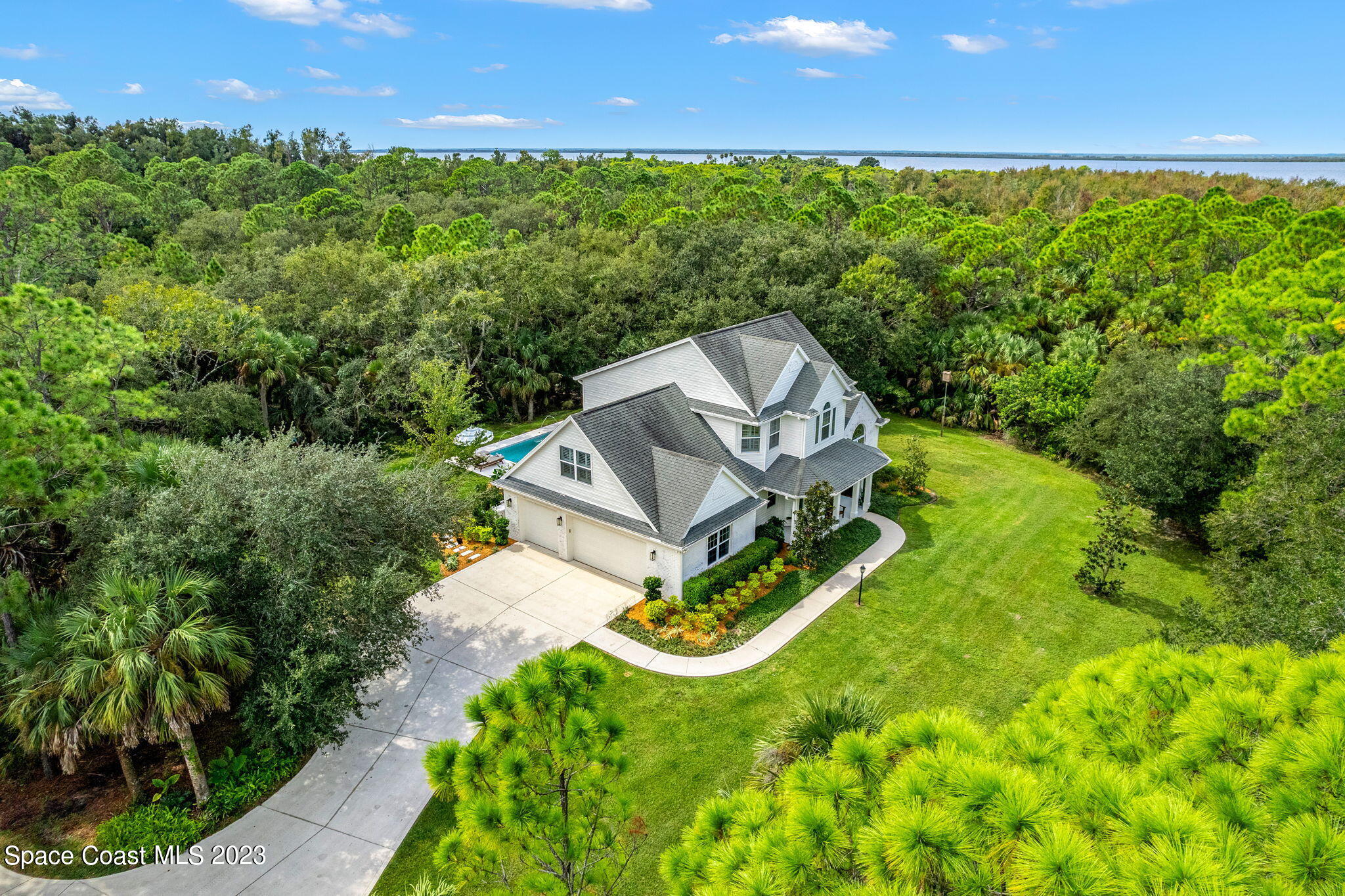 5595 Willoughby Drive Melbourne, FL 32934 - Photo 33 of 40 an aerial view of a house with a yard