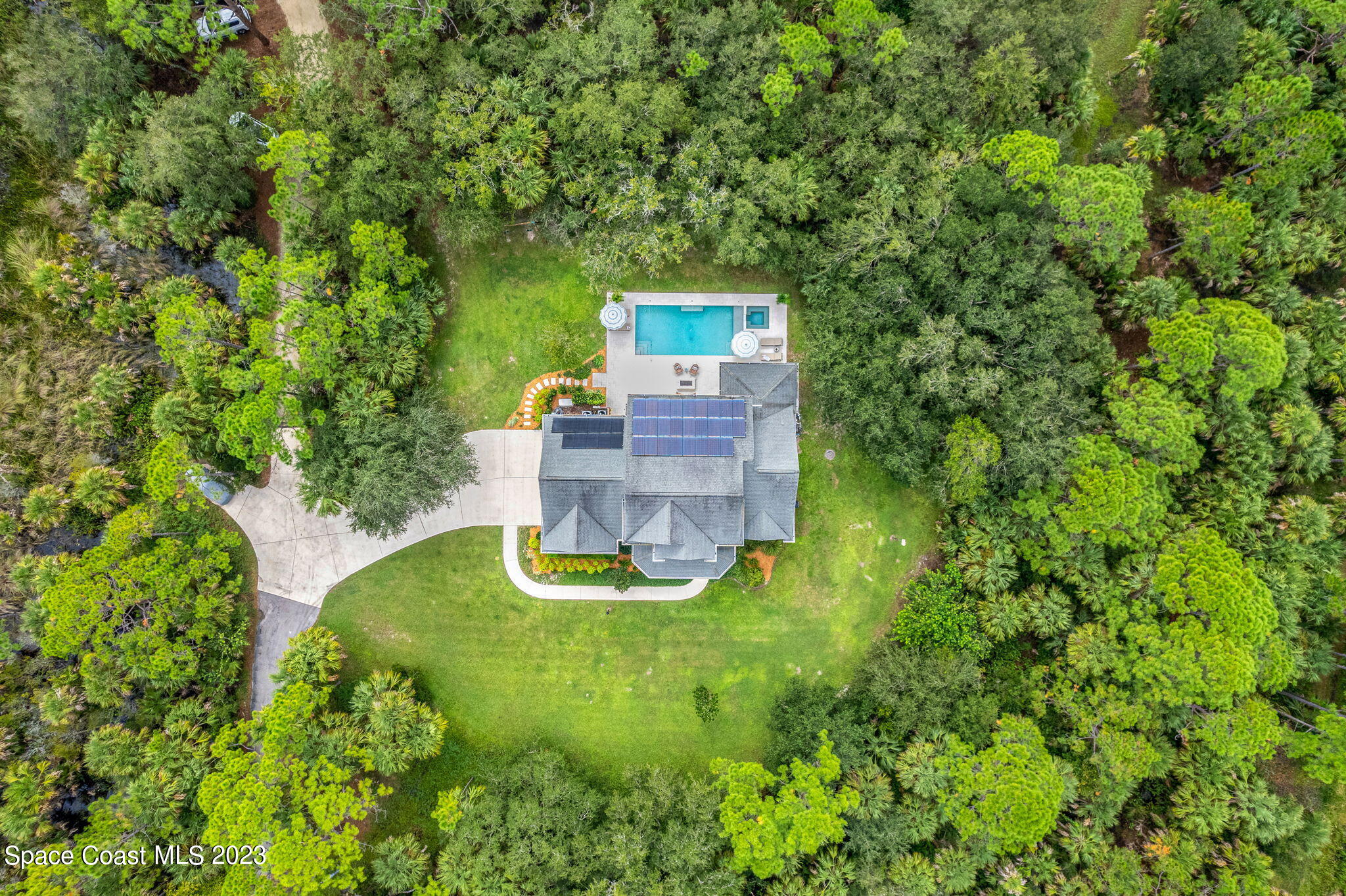 5595 Willoughby Drive Melbourne, FL 32934 - Photo 38 of 40 a view of a house with a yard