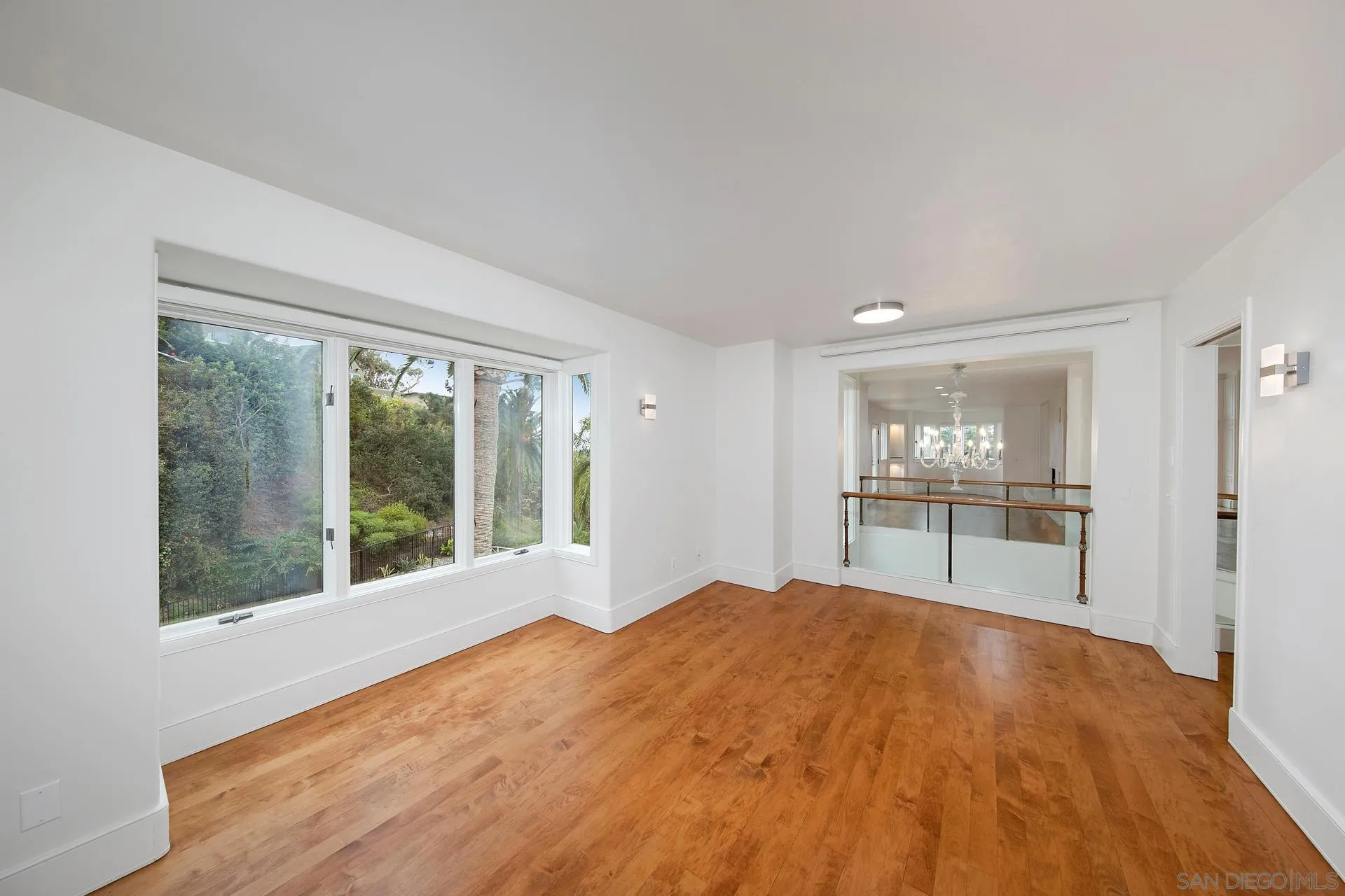 1735 Seaview Avenue Del Mar, CA 92014 - Photo 12 of 51 a bedroom with a bed and a large window with outer view