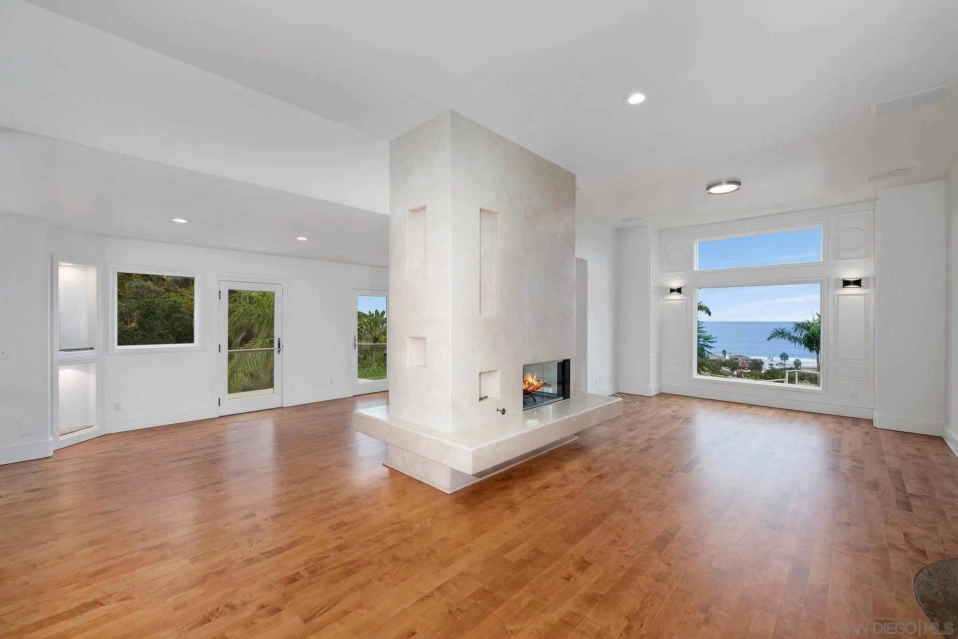 1735 Seaview Avenue Del Mar, CA 92014 - Photo 14 of 51 a view of an empty room with wooden floor and a window