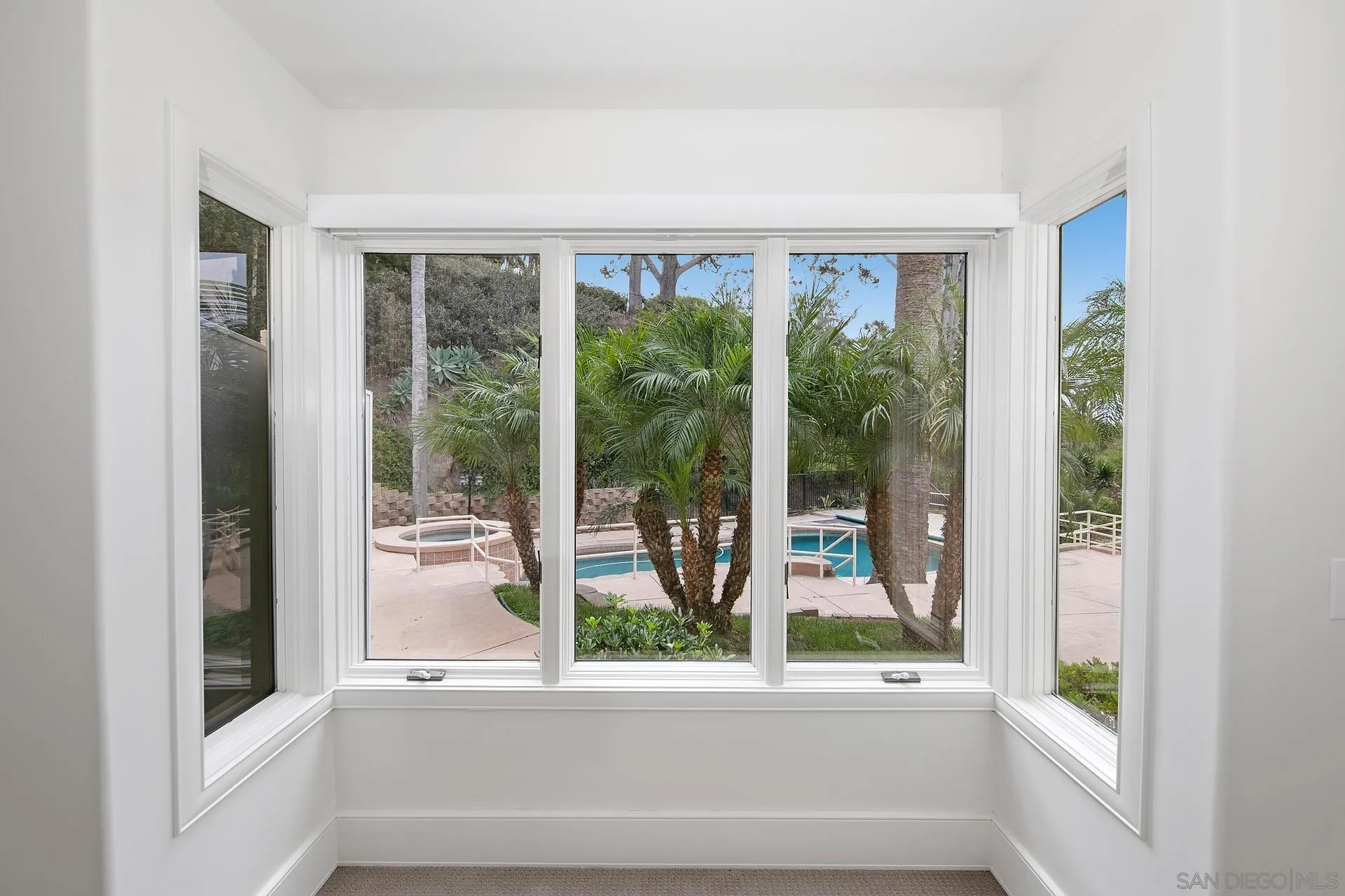 1735 Seaview Avenue Del Mar, CA 92014 - Photo 23 of 51 a view of a room that has a large window and pool