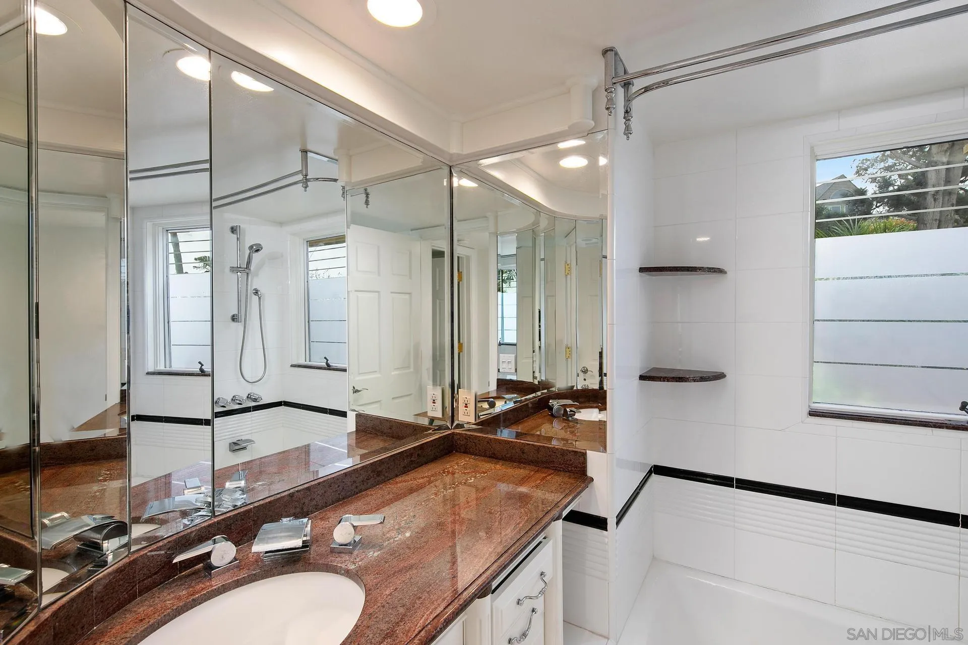 1735 Seaview Avenue Del Mar, CA 92014 - Photo 27 of 51 a bathroom with a granite countertop sink a mirror and shower