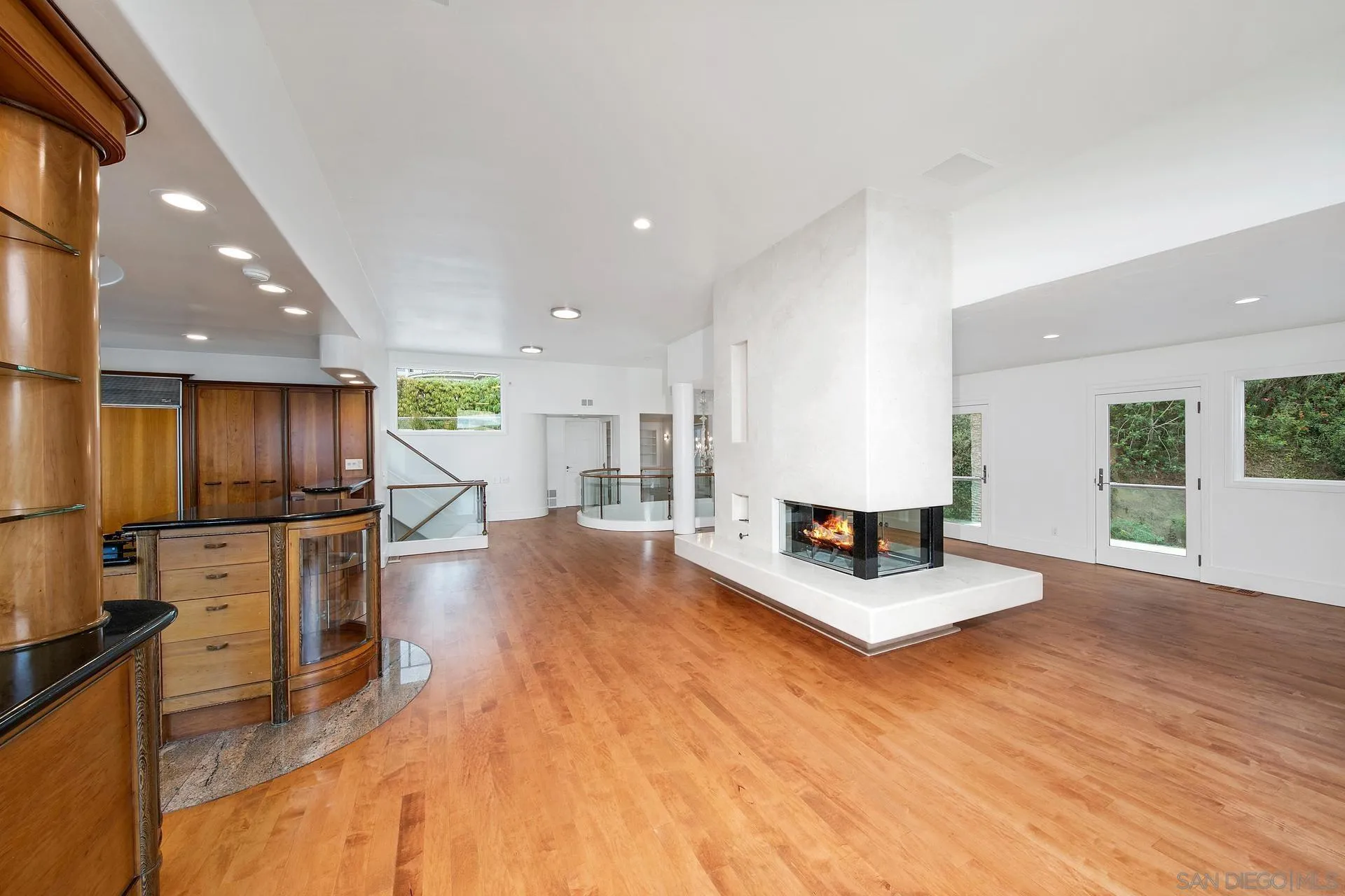 1735 Seaview Avenue Del Mar, CA 92014 - Photo 7 of 51 a living room with stainless steel appliances kitchen island furniture and a wooden floor