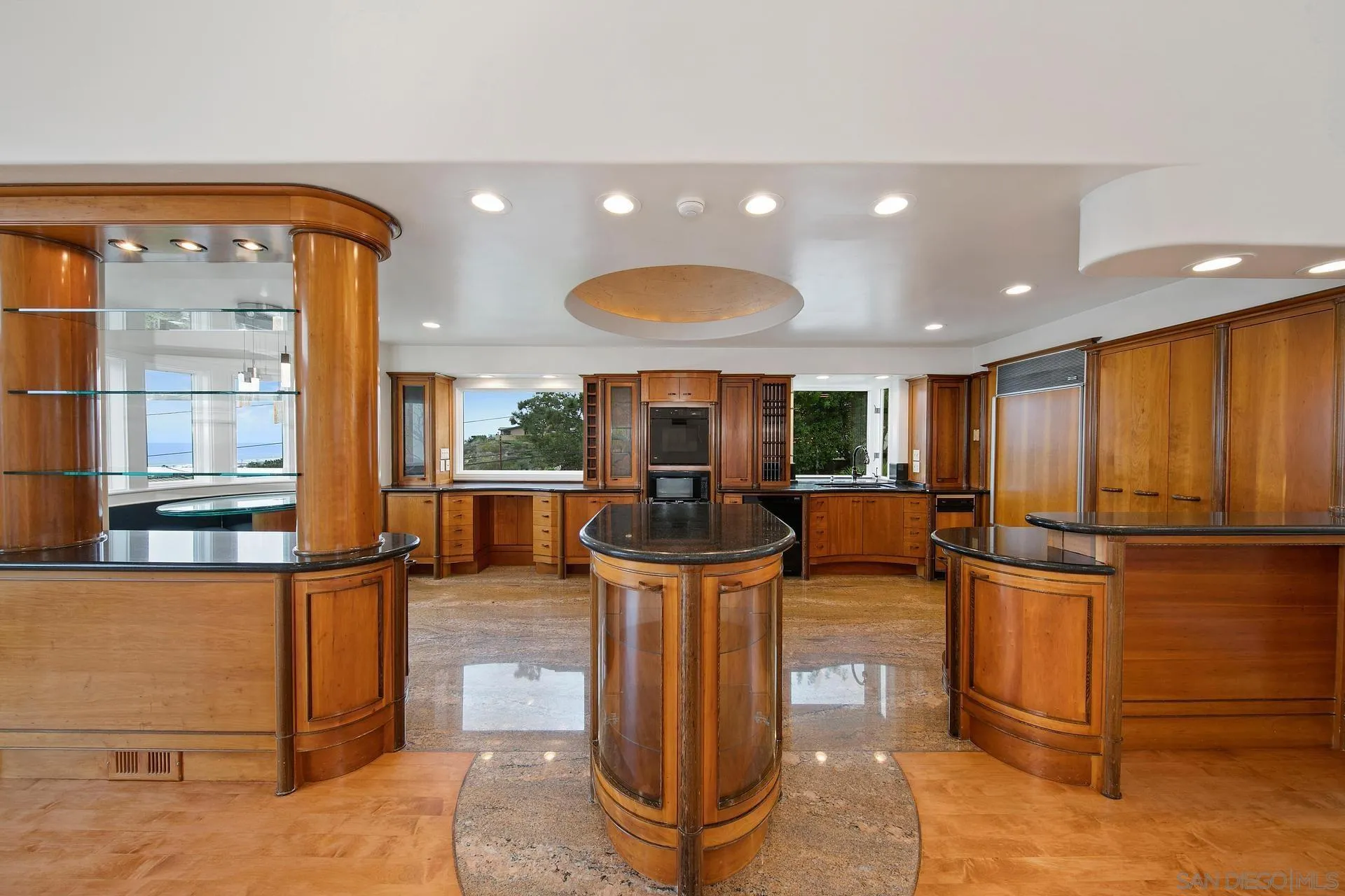 1735 Seaview Avenue Del Mar, CA 92014 - Photo 8 of 51 a living room with furniture a large window and stainless steel appliances