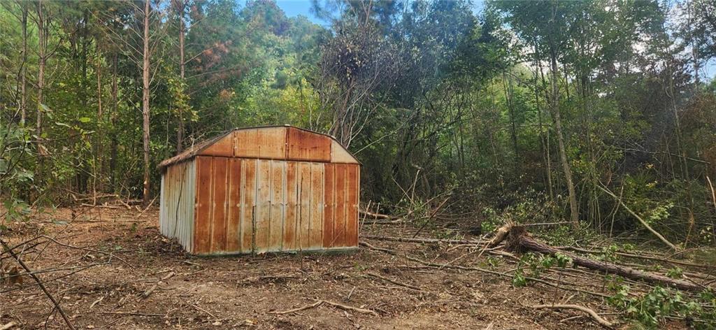 252 Beatrice Court Ranger, GA 30734 - Photo 7 of 11 a view of a tiny house with a yard