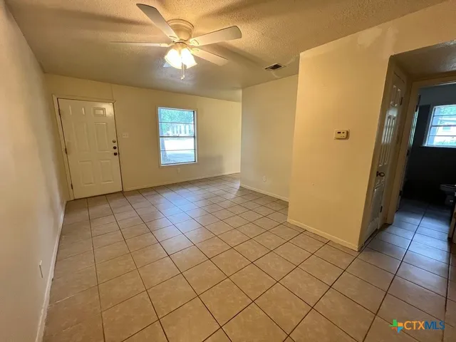 a view of an empty room and window