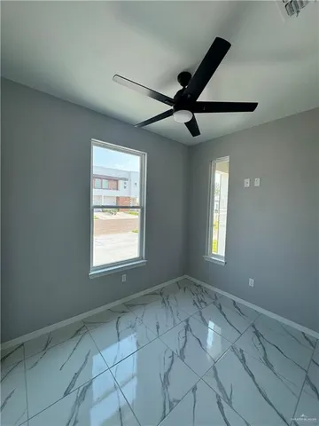 a view of an empty room and window