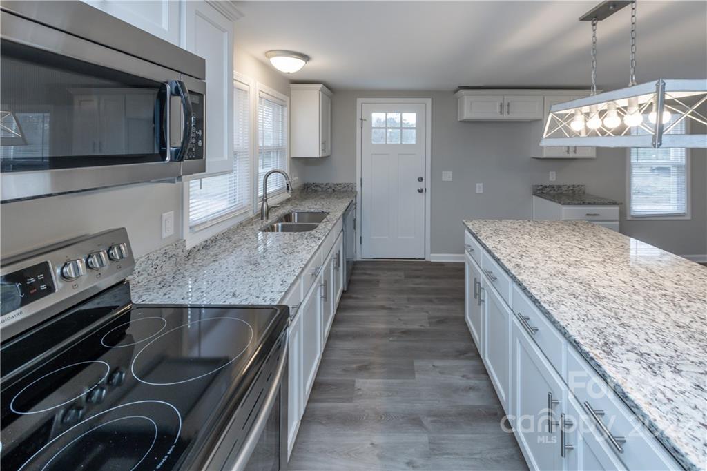 363 Porter Road Rock Hill, SC 29730 - Photo 14 of 31 a kitchen with a stove and a sink