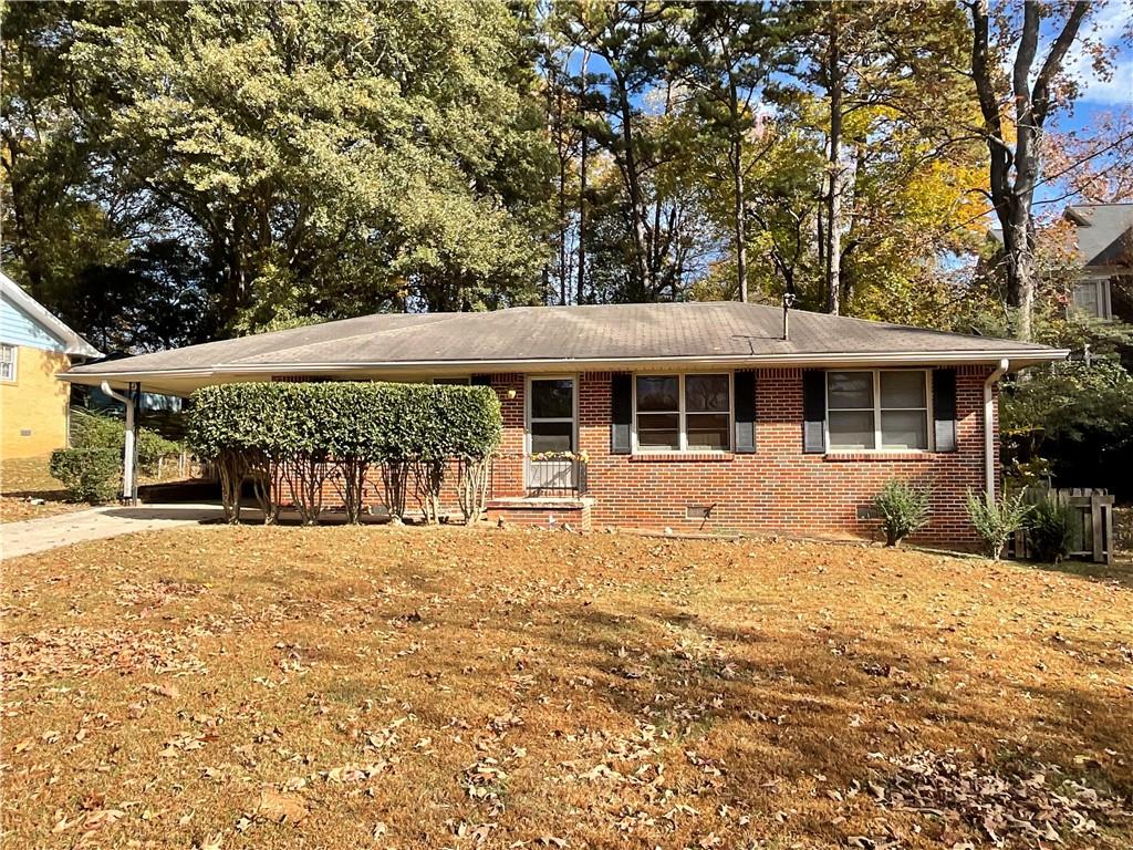 1269 McLendon Drive Decatur, GA 30033 - Photo 1 of 1 a front view of a house with a yard