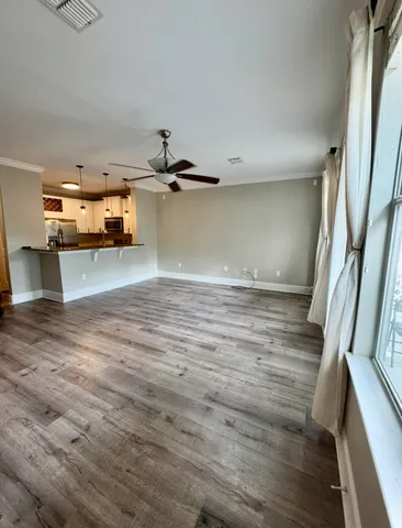 a view of a kitchen with a sink and cabinets
