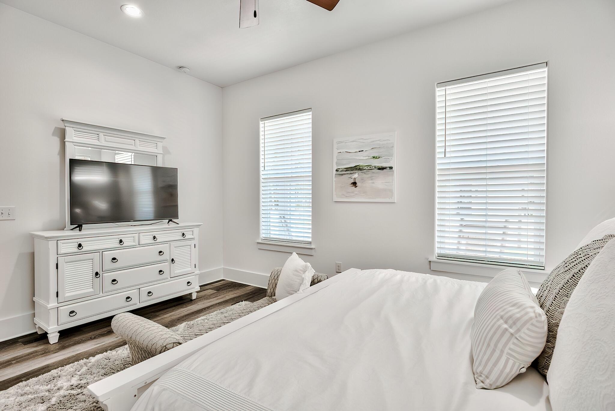 61 Carefree Lane Santa Rosa Beach, FL 32459 - Photo 13 of 30 a bedroom with a bed and a flat screen tv