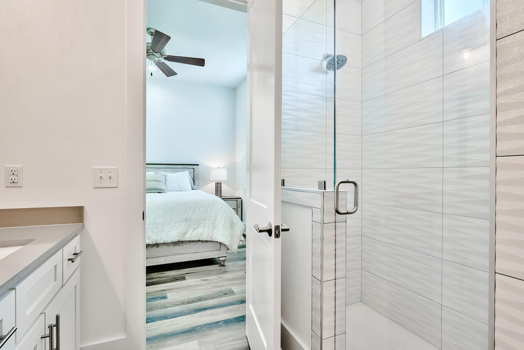 61 Carefree Lane Santa Rosa Beach, FL 32459 - Photo 19 of 30 a en suite bathroom with a sink and mirror
