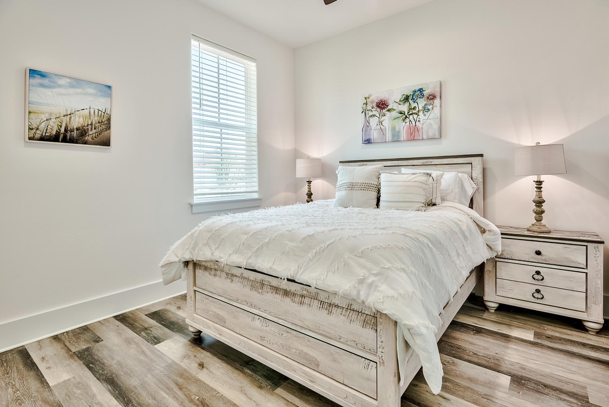 61 Carefree Lane Santa Rosa Beach, FL 32459 - Photo 20 of 30 a bedroom with a bed and a painting on the wall