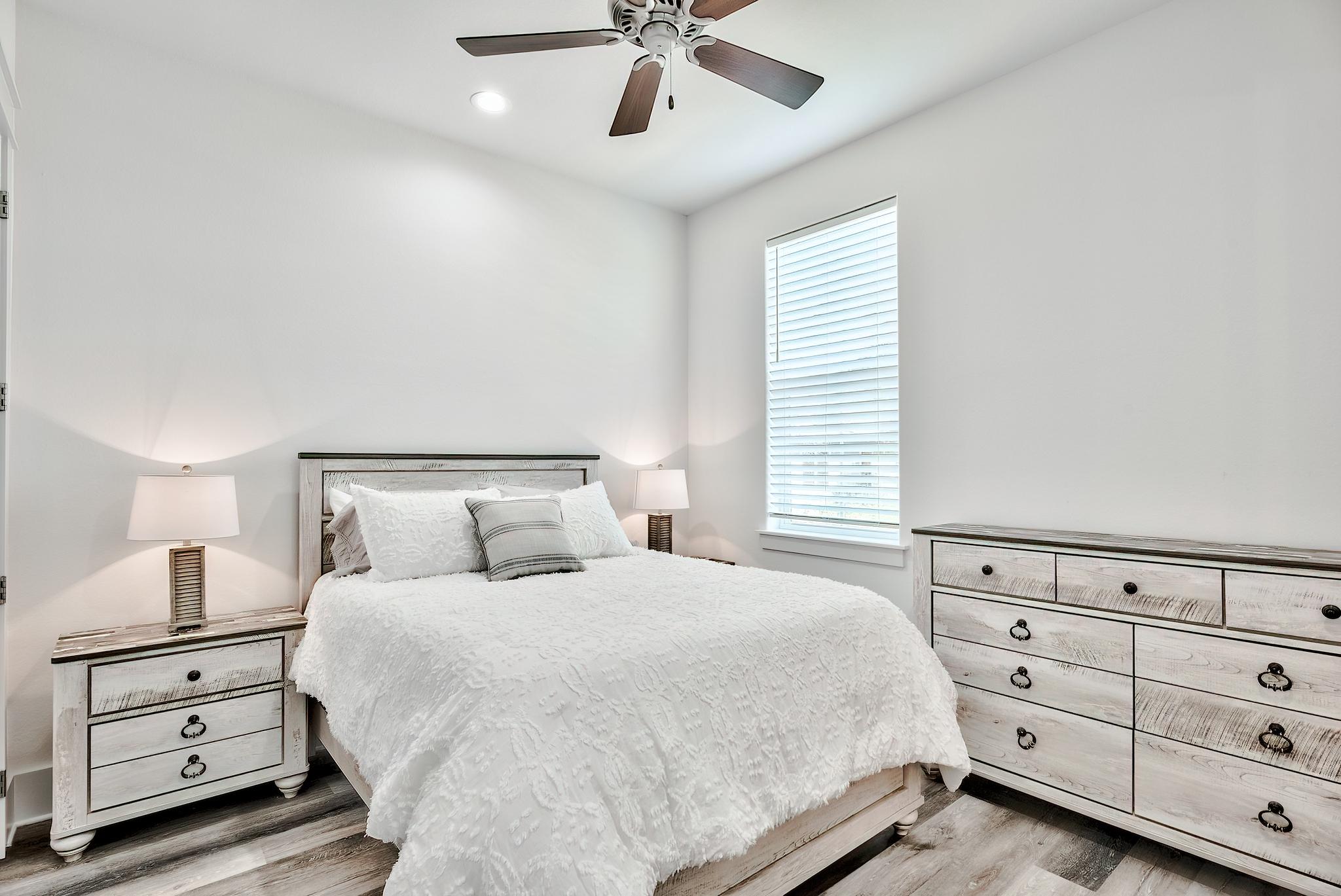 61 Carefree Lane Santa Rosa Beach, FL 32459 - Photo 21 of 30 a bedroom with a bed and window