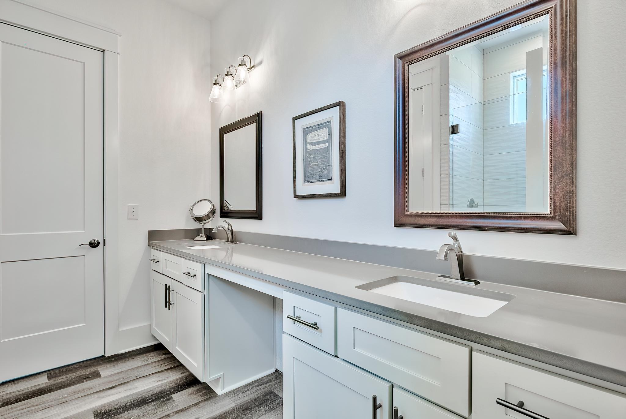 61 Carefree Lane Santa Rosa Beach, FL 32459 - Photo 22 of 30 a bathroom with a sink and a mirror