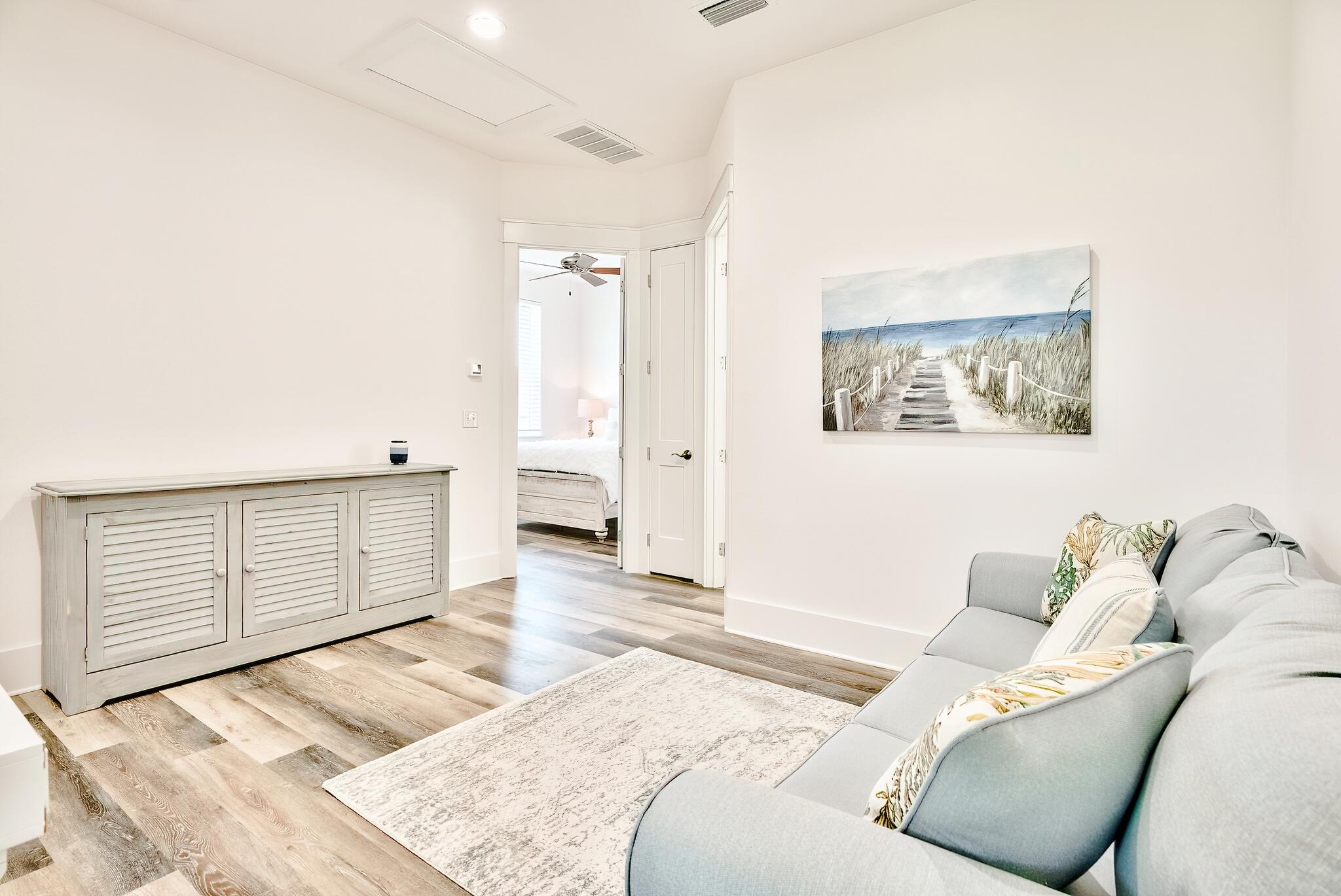 61 Carefree Lane Santa Rosa Beach, FL 32459 - Photo 23 of 30 a bedroom with a bed and walk in closet