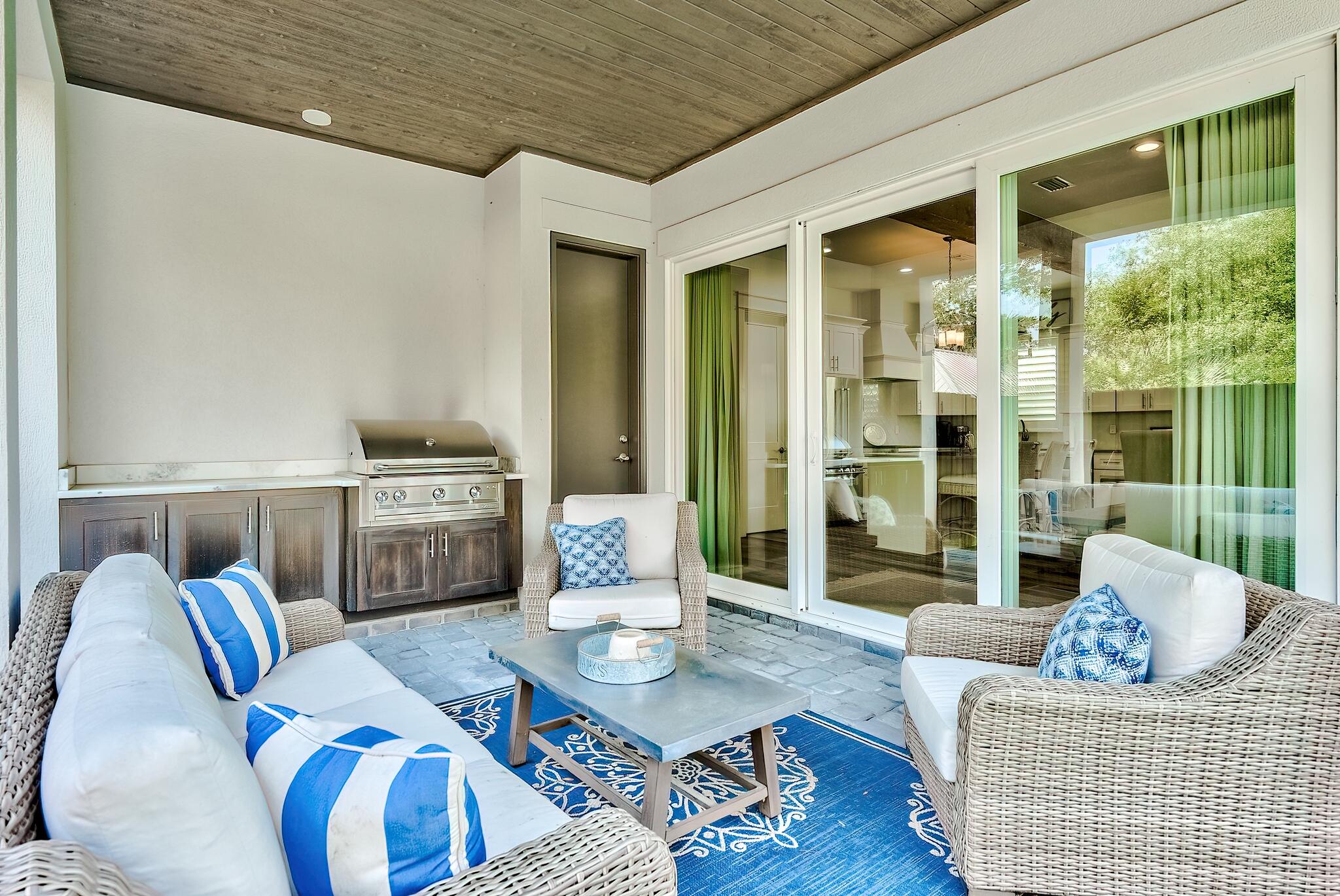 61 Carefree Lane Santa Rosa Beach, FL 32459 - Photo 24 of 30 a living room with furniture and a floor to ceiling window