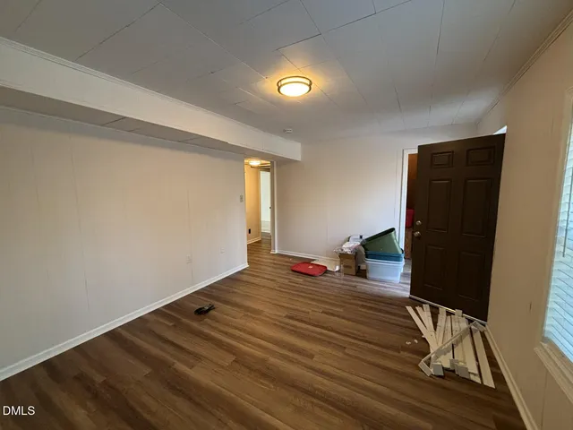 a view of a livingroom with wooden floor