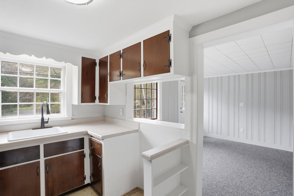 11 Sherman's Bridge Road Wayland, MA 01778 - Photo 11 of 38 a view of a kitchen cabinets and a stove
