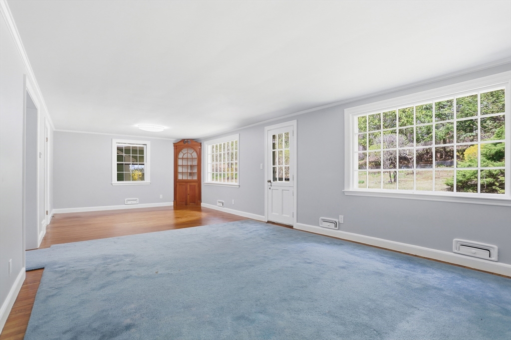 11 Sherman's Bridge Road Wayland, MA 01778 - Photo 17 of 38 an empty room with windows