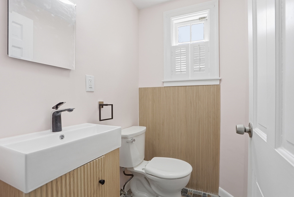 11 Sherman's Bridge Road Wayland, MA 01778 - Photo 19 of 38 a bathroom with a sink a toilet and a mirror