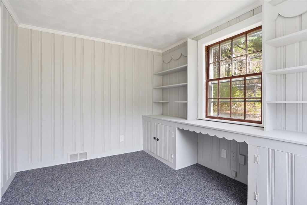11 Sherman's Bridge Road Wayland, MA 01778 - Photo 22 of 38 a view of an empty room with a window
