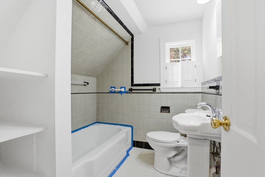 11 Sherman's Bridge Road Wayland, MA 01778 - Photo 31 of 38 a bathroom with a sink a toilet and shower