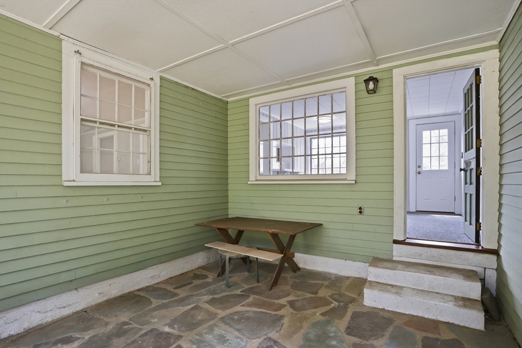 11 Sherman's Bridge Road Wayland, MA 01778 - Photo 36 of 38 a view of a livingroom with furniture and windows
