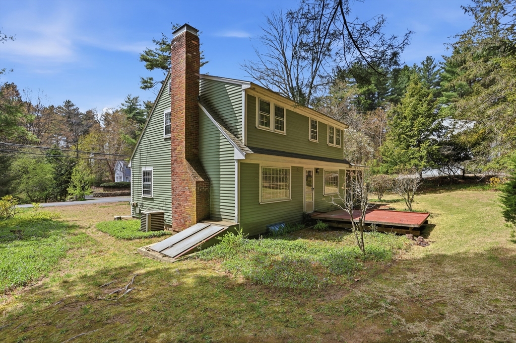 11 Sherman's Bridge Road Wayland, MA 01778 - Photo 38 of 38 a front view of a house with garden